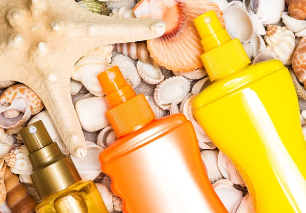 Cosmetic sunscreen products with variety of shells and starfish