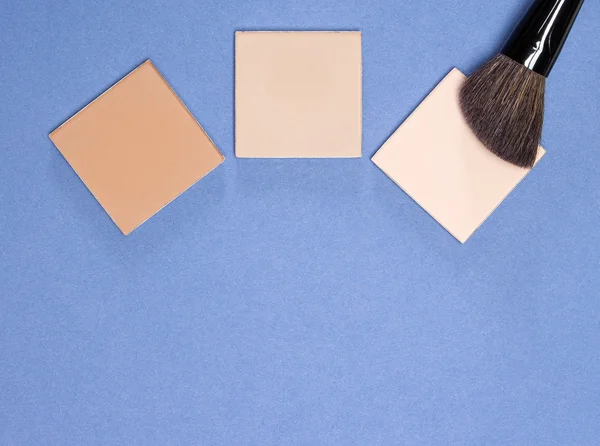 Different shades of compact cosmetic powder