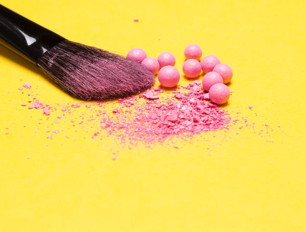 Makeup brush with crushed and whole shimmer blush balls