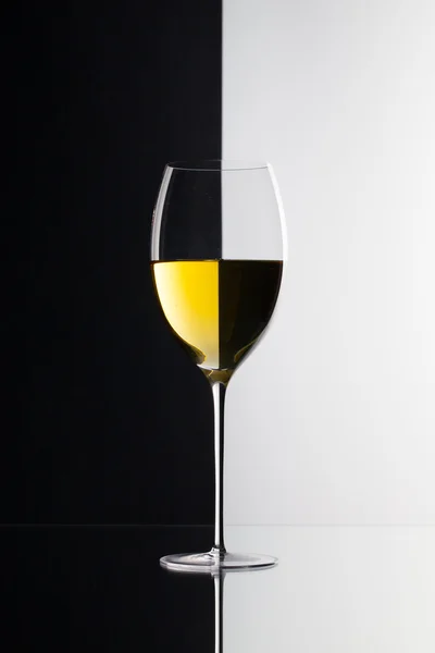 Single glass of wine  isolated on black and white background