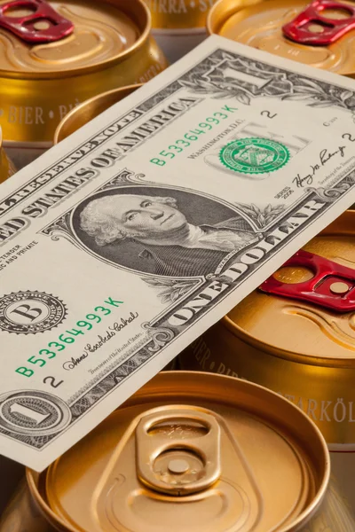 Cans of beer and US dollar