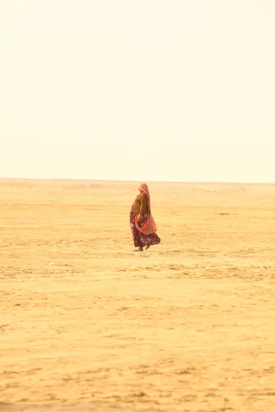Poor Woman in Desert