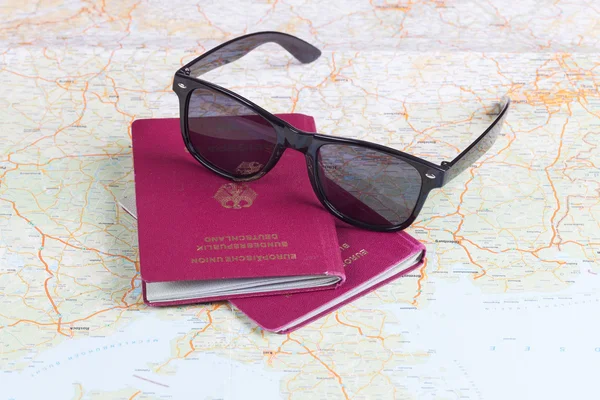 German travel passports and sunglasses