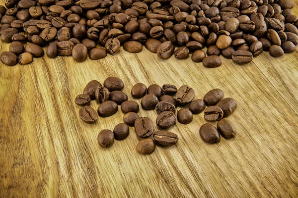 Coffee beans on vintage wooden board