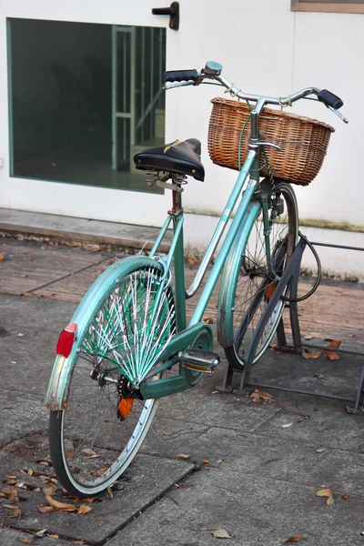 Old bicycle with wicker basket, Italy