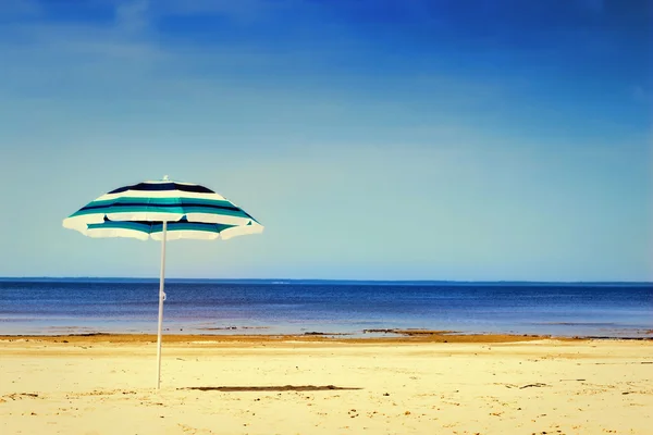 Sun umbrella on sunny beach