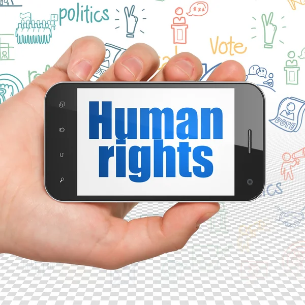 Politics concept: Hand Holding Smartphone with Human Rights on display