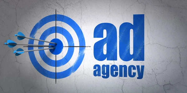 Advertising concept: target and Ad Agency on wall background