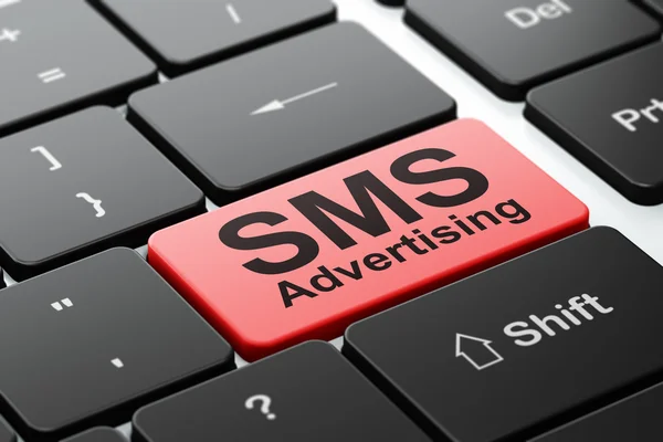 Marketing concept: SMS Advertising on computer keyboard background