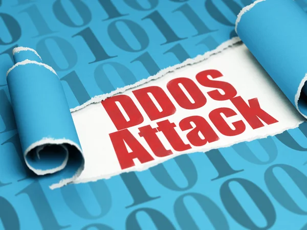 Privacy concept: red text DDOS Attack under the piece of  torn paper