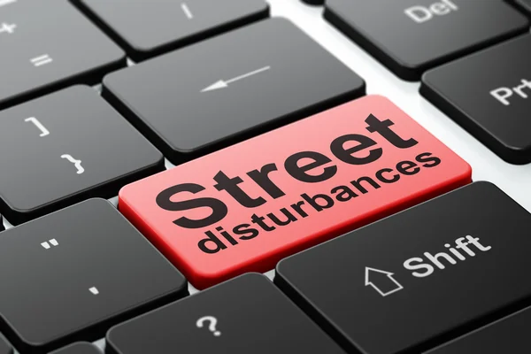 Politics concept: Street Disturbances on computer keyboard background