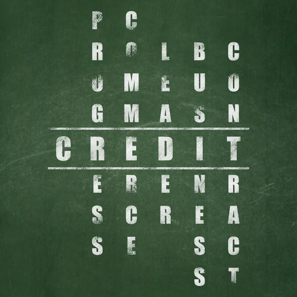 Finance concept: word Credit in solving Crossword Puzzle