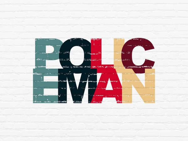 Law concept: Policeman on wall background