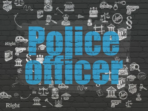 Law concept: Police Officer on wall background