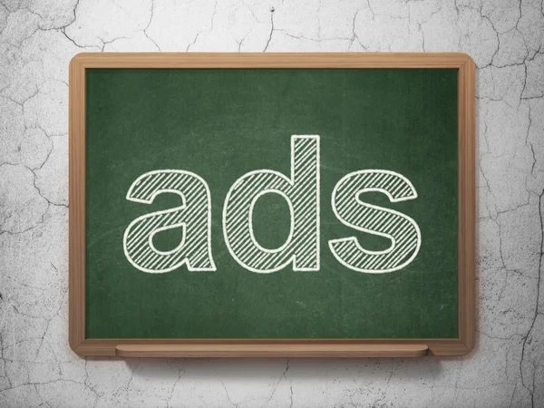 Advertising concept: Ads on chalkboard background