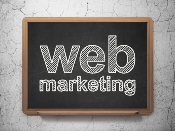 Web development concept: Web Marketing on chalkboard background