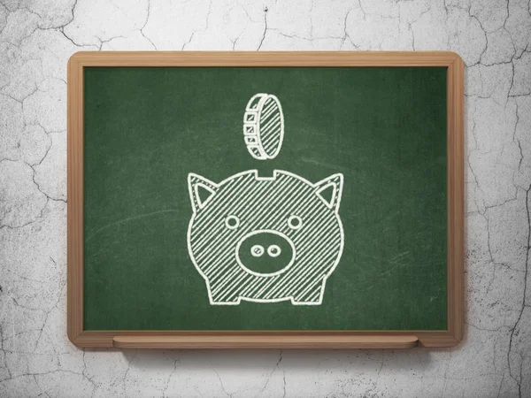 Money concept: Money Box With Coin on chalkboard background