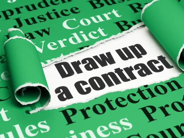 Law concept: black text Draw up A contract under the piece of  torn paper