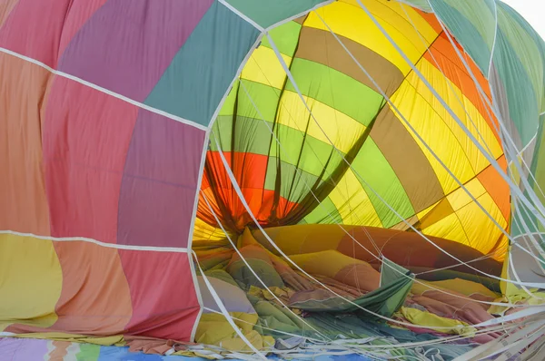 Hot air balloon being deflated on the ground