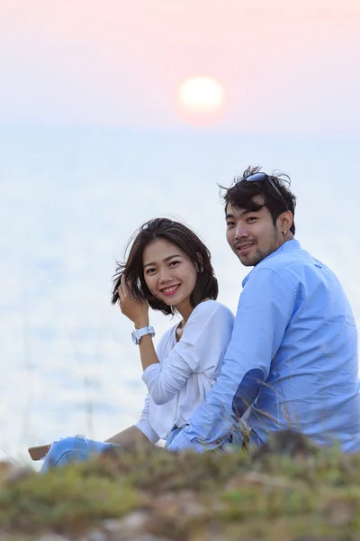 Portrait of asian younger man and woman relaxing vacation at sea