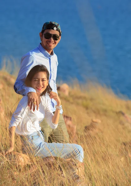 Portrait of asian younger man and woman relaxing vacation at sea