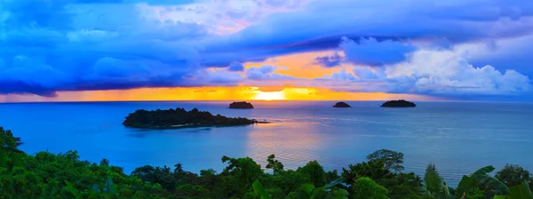 Panorama scene of raining clouds and sun set sky behind koh chan