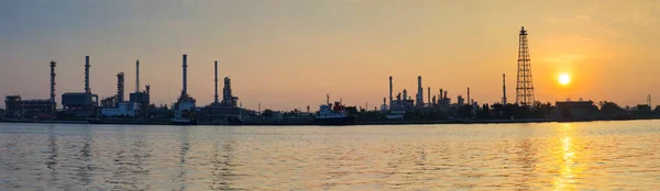 Beautiful sun rising scene with oil ,gas refinery industry estat