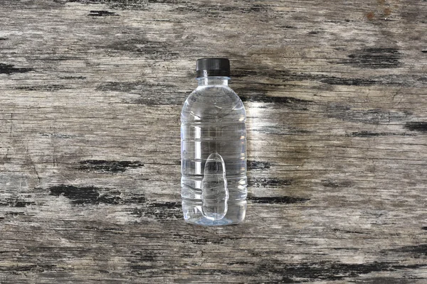 Pure water on wood back ground