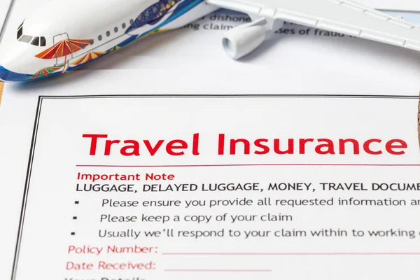 Travel Insurance Claim application form on brown envelope, busin