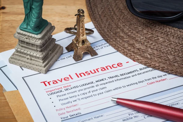 Travel Insurance Claim application form and hat with eyeglass an