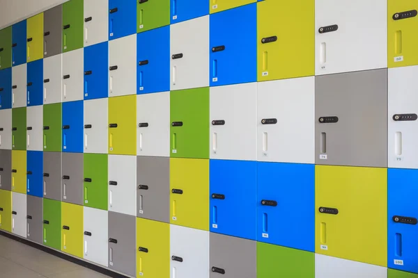 Row of colorful lockers and security password code on door for s