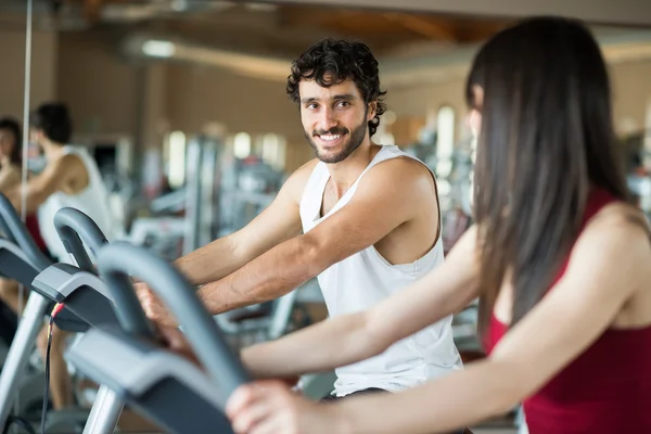 People working out on stationary bikes