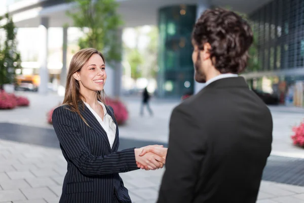 Businesswoman giving an handshake