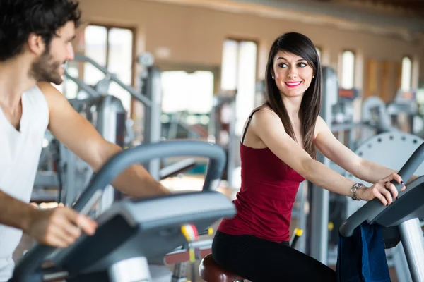 People working out on stationary bike