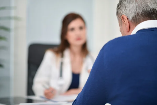 Patient talking to doctor