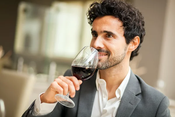 Man tasting glass of wine