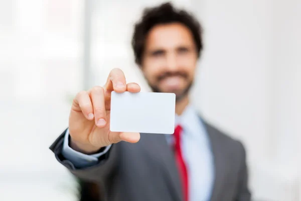 Businessman showing blank card