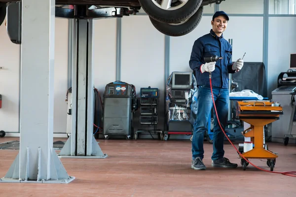 Mechanic at work in his garage