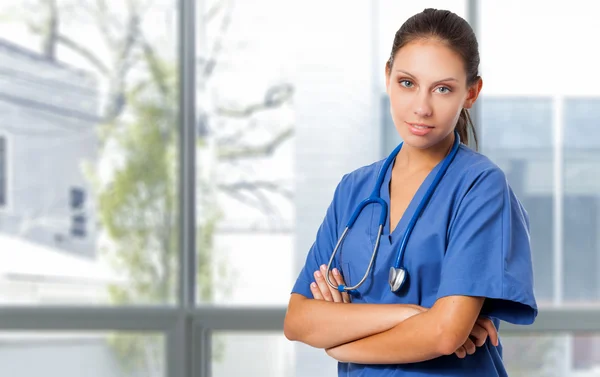 Nurse with arms crossed in hospital