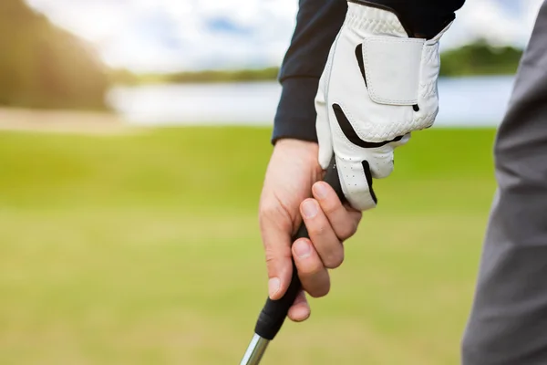 Golfer shooting a golf ball