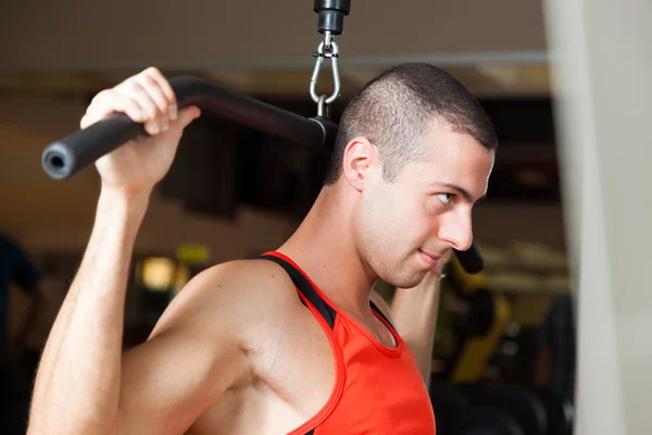 Man training hard in a gym