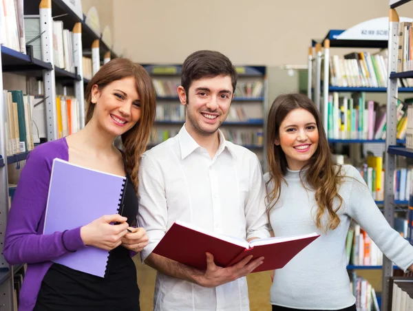 Smiling students in a library