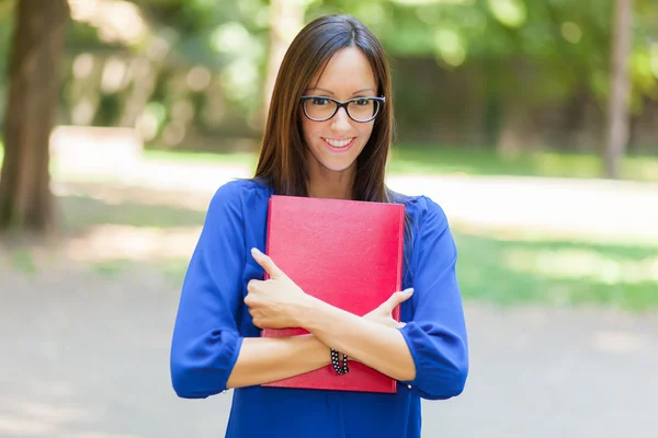 Female student holding book