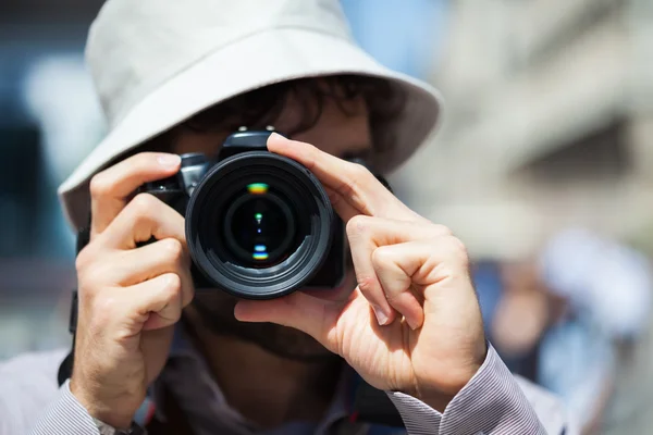 Tourist using his camera