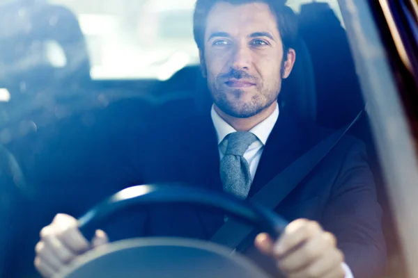 Businessman driving a car