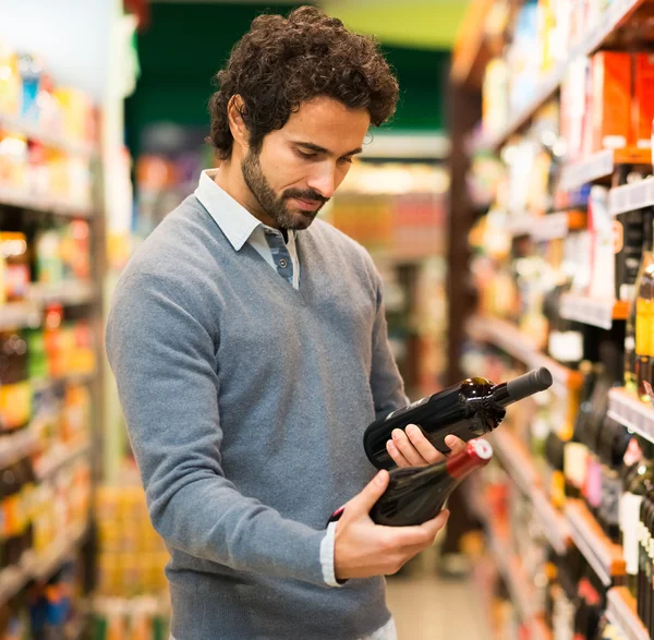 Man choosing wine bottle