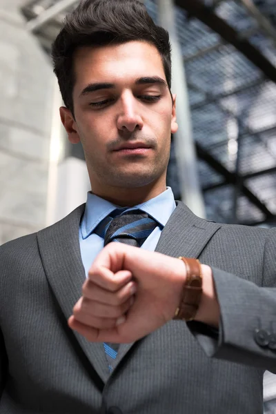 Businessman taking look at watch