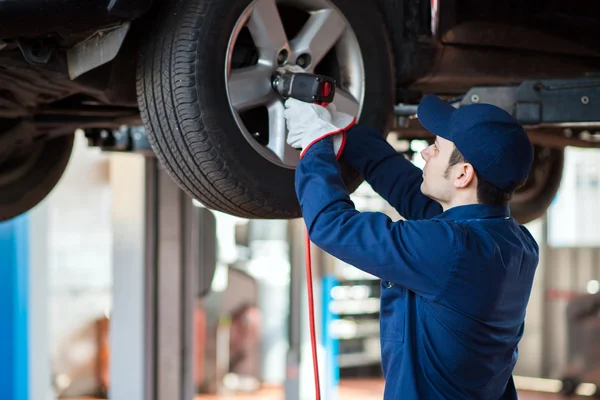 Mechanic at work in garage