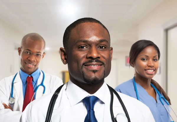 African doctor in front of medical team