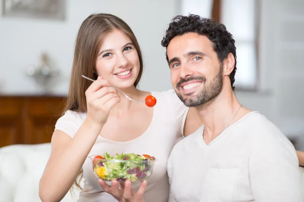 Couple eating a salad